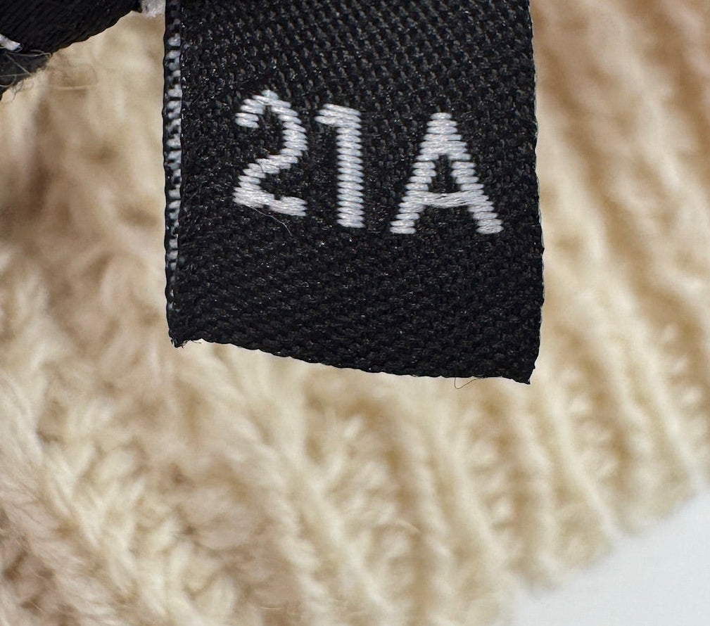 Chanel White Beanie with Black Pearls Logo